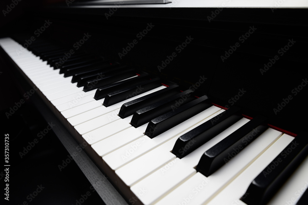 black and white piano keys closeup, standard 88 key, dark background black and white piano keys closeup, standard 88 key, dark background