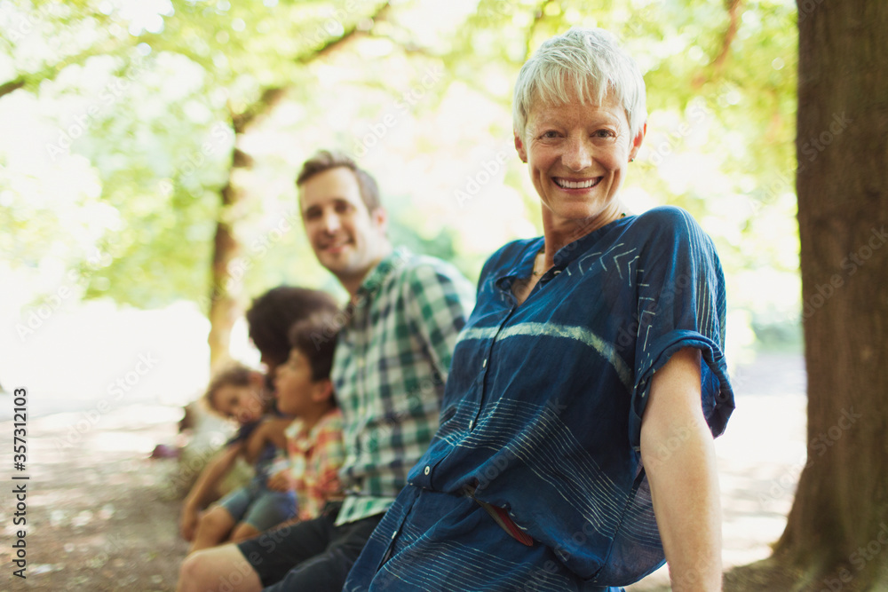 Fototapeta premium Portrait smiling multi-generation family in woods