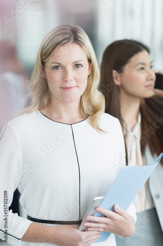 Wallpaper Mural Portrait confident businesswoman with folder and digital tablet Torontodigital.ca