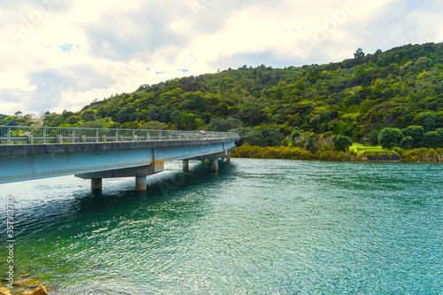 Hibiscus Coast Highway Bridge across Waiwera River, Auckland New Zealand; Calm Water photo