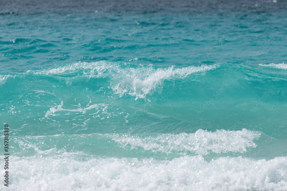 Turquoise blue wave at the whitest beach in the world.