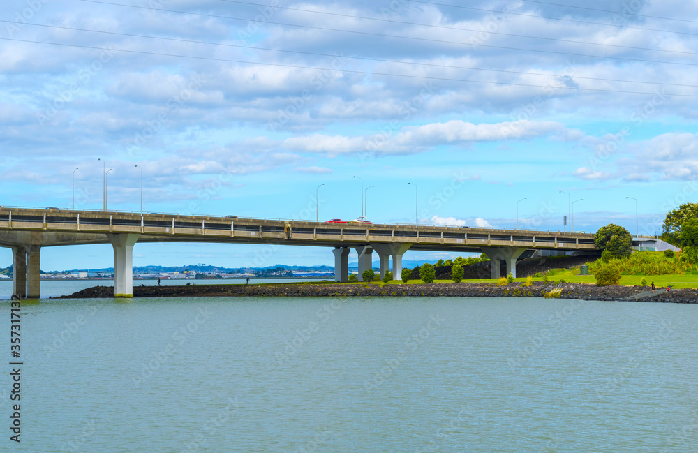 Landscape View to Mangere bridge over the Manukau Harbour, Motorway Bridge in South-Western Auckland New Zealand Landscape View to Mangere bridge over the Manukau Harbour, Motorway Bridge in South-Western Auckland New Zealand
