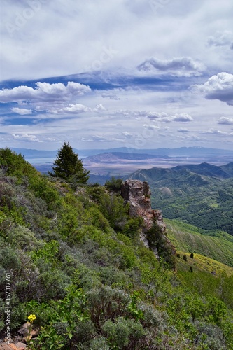 Rocky Mountain Wasatch Front peaks, panorama landscape view from Butterfield Canyon Oquirrh range toward Provo, Tooele Utah Lake by Rio Tinto Bingham Copper Mine, Great Salt Lake Valley in spring. Uta photo