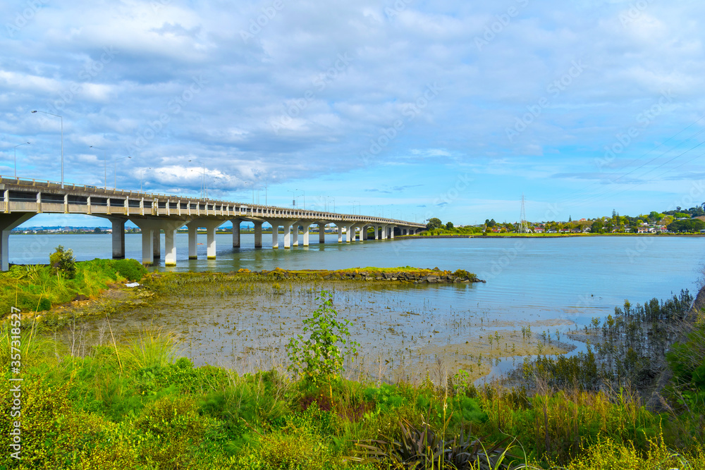 Landscape View to Mangere bridge over the Manukau Harbour, Motorway Bridge in South-Western Auckland New Zealand