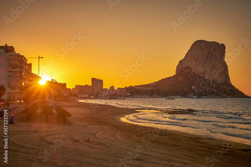 morning sunrise against the backdrop of cliffs and the seashore, view of the promenade of the city of Calpe Spain