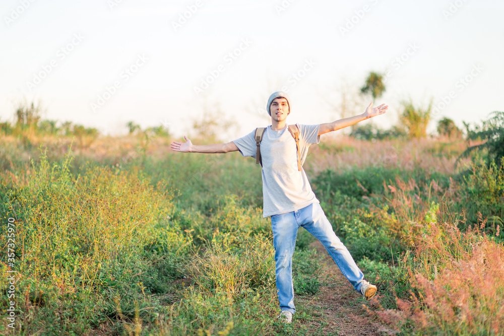 Young man happy and having fun in a field Young man happy and having fun in a field