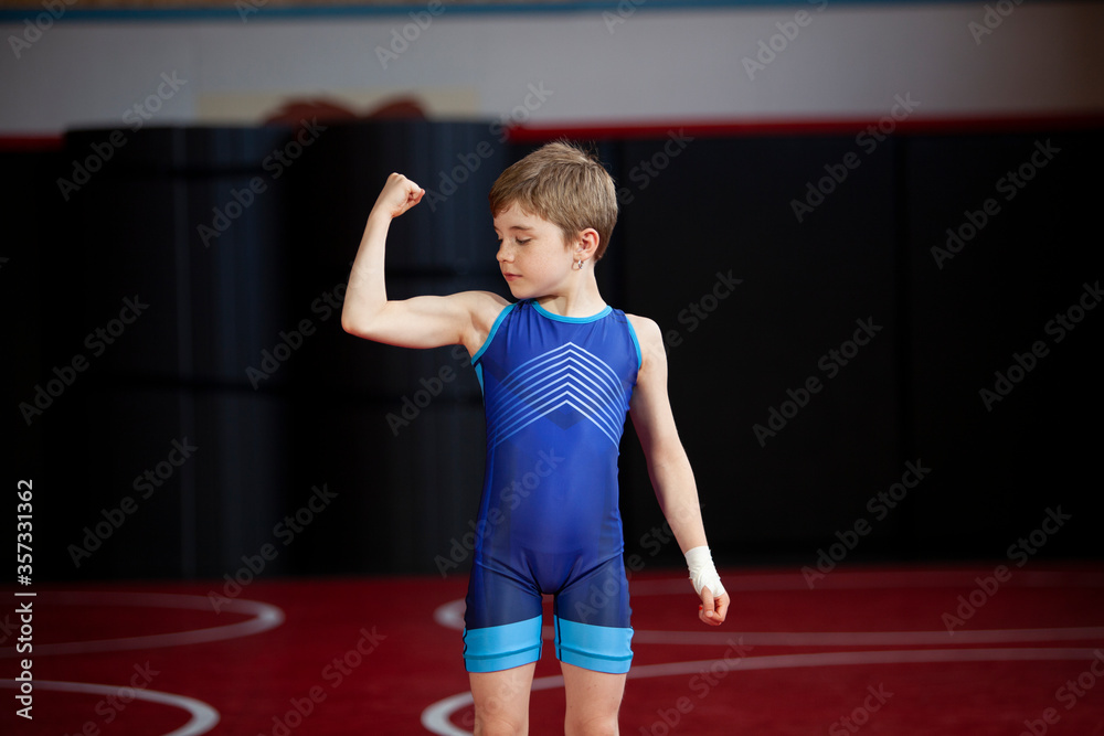 Young female wrestler in a blue singlet Stock Photo | Adobe Stock
