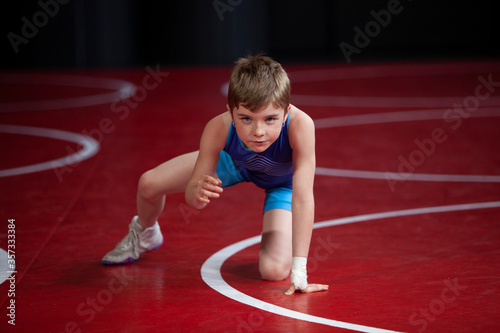 Φωτογραφία Young female wrestler in a blue singlet