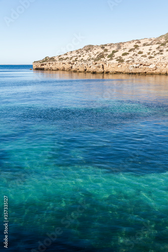 Limestone cliffs and clear waters of Point Sinclair, South Australia photo