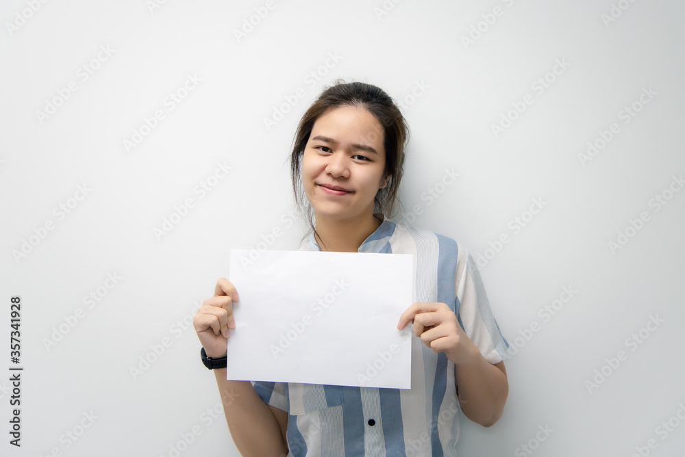 Woman showing blank white paper for copy space Woman showing blank white paper for copy space