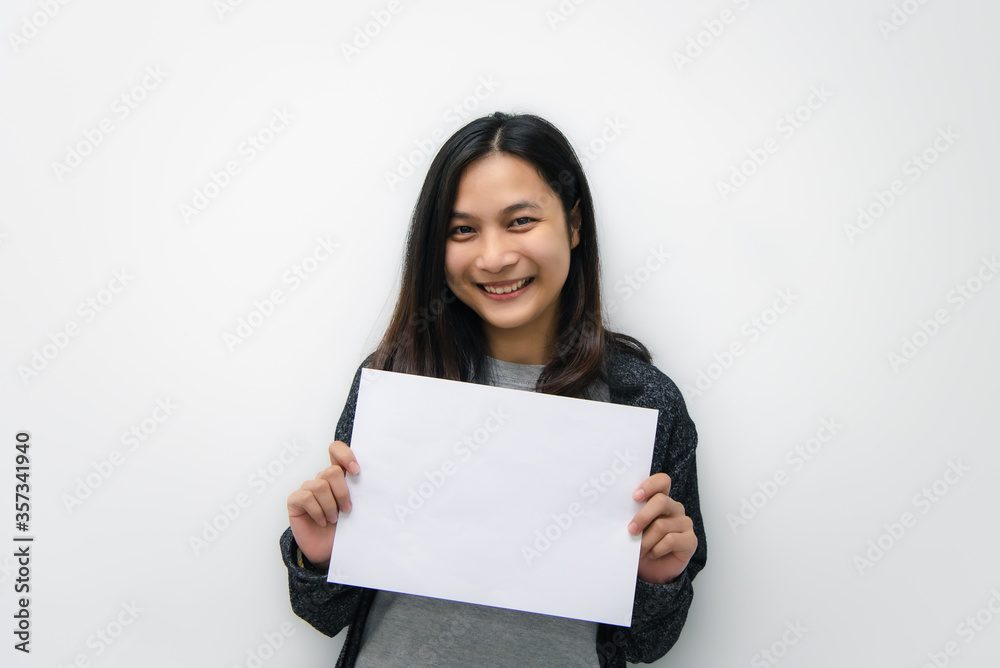 Woman showing blank white paper for copy space Woman showing blank white paper for copy space