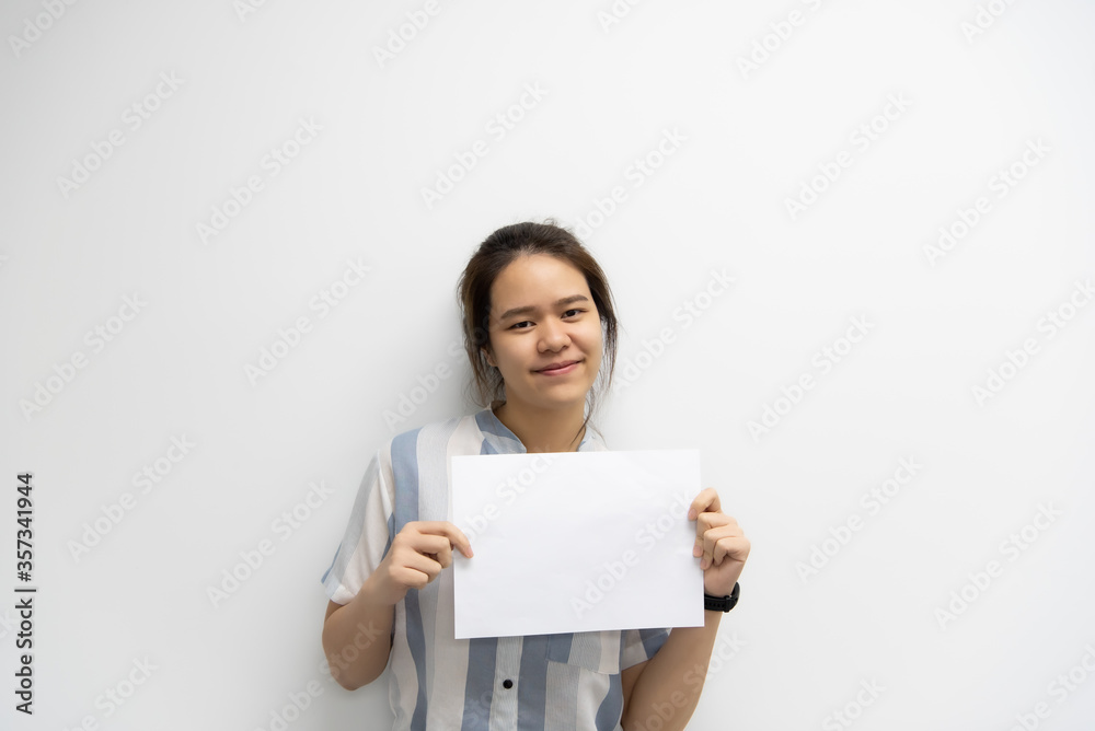 Woman showing blank white paper for copy space Woman showing blank white paper for copy space