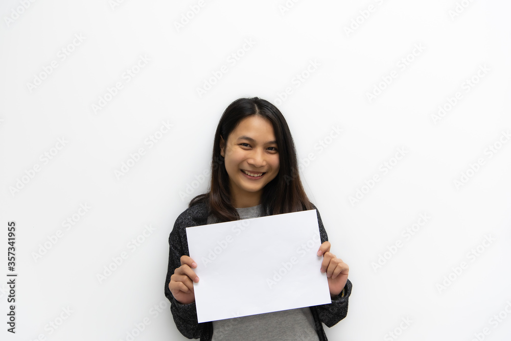 Woman showing blank white paper for copy space Woman showing blank white paper for copy space