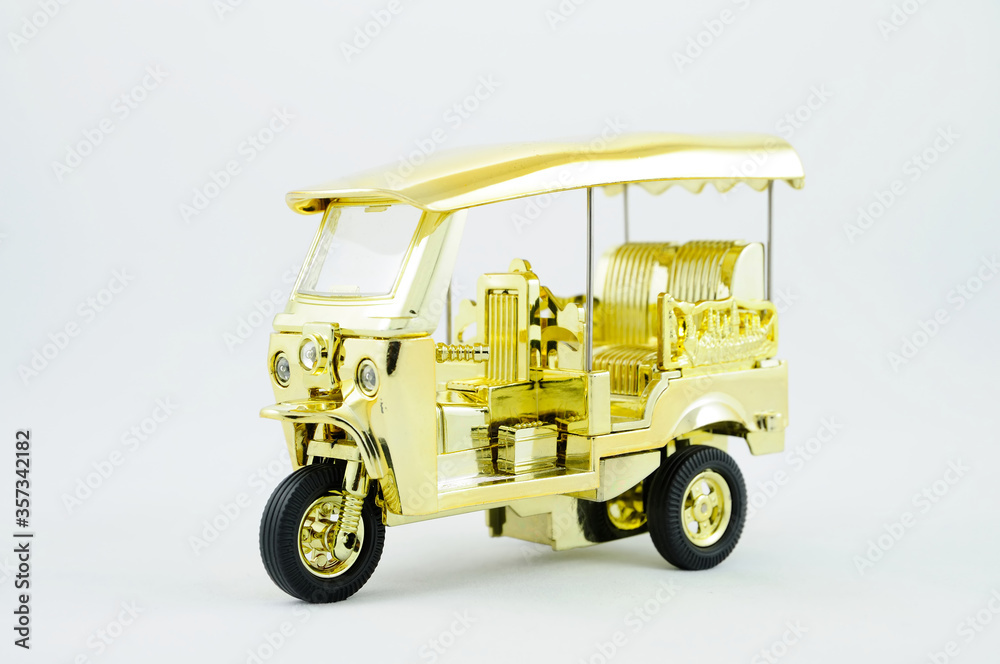 A Miniature Tuktuk on White Background