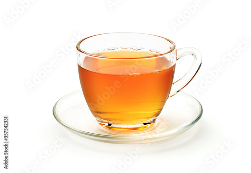 Glass cup of hot tea with saucer isolated on white background. Clipping path.