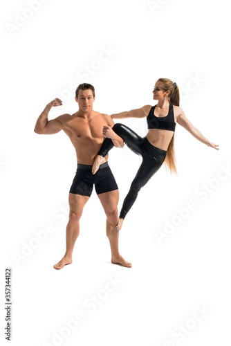 Young couple doing acrobatics isolated view