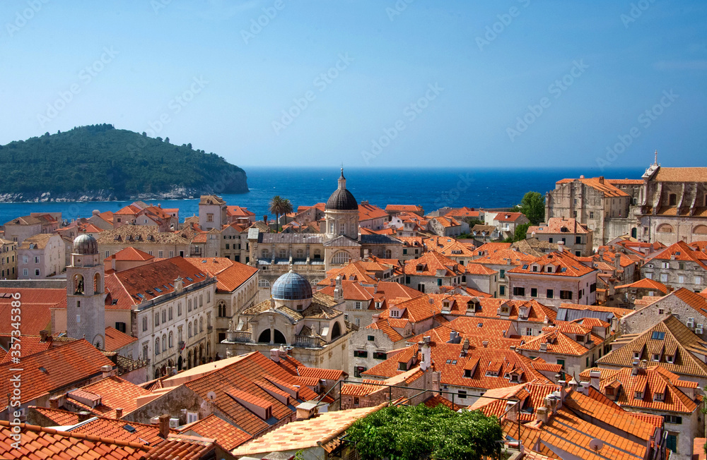 red roofs of Dubrovnik old town Croatia with a clear blue sky and Adriatic sea in the background