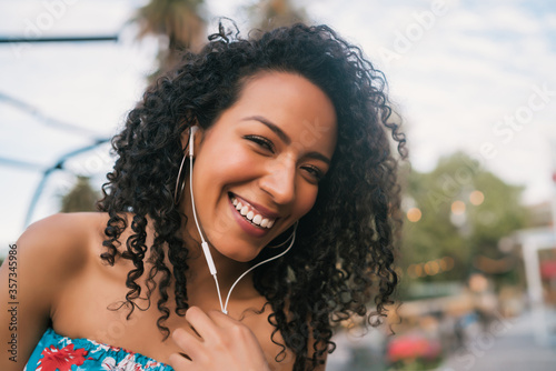 Afro american woman listening music