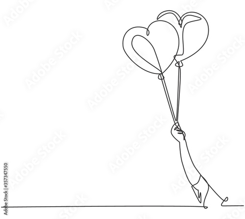 One continuous line drawing of young happy girl holding a couple cute heart shaped balloon tightly. Romantic wedding invitation card concept. Modern single line draw design graphic vector illustration