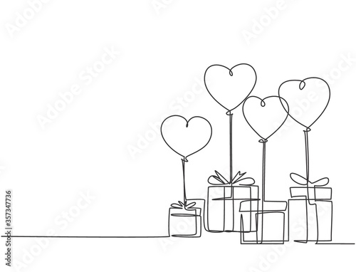 One continuous line drawing of cute gifts box tied with ribbon tape and flying heart shaped gas balloon. Romantic marriage proposal gift concept single line draw design graphic vector illustration