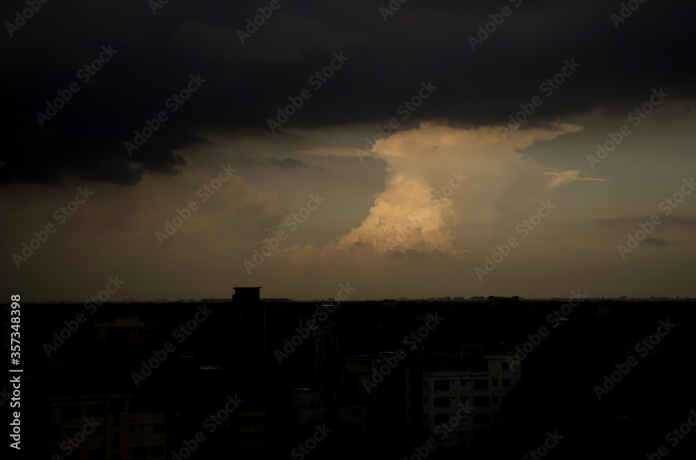 Dramatic & Colorful sunset sky from an above building after rain. sunset panorama with raspberry clouds over a small town against a blue sky. Cityscape and landscape beauty. Dramatic & Colorful sunset sky from an above building after rain. sunset panorama with raspberry clouds over a small town against a blue sky. Cityscape and landscape beauty.