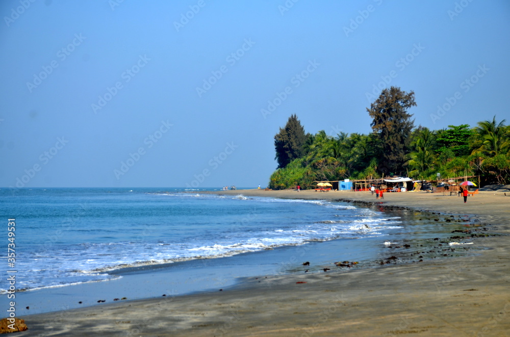 Tropical St. Martin beach with sand and Bay of Bengal travel tourism wide panorama background concept. The island locally known as Narkel Jinjira is the only coral island. Famous tourist place. 