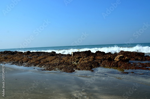 The sea waves are scratching over the coral at St. Martin's Island. The island locally known as Narkel Jinjira is the only coral island and one of the most famous tourist spots of Bangladesh.  photo