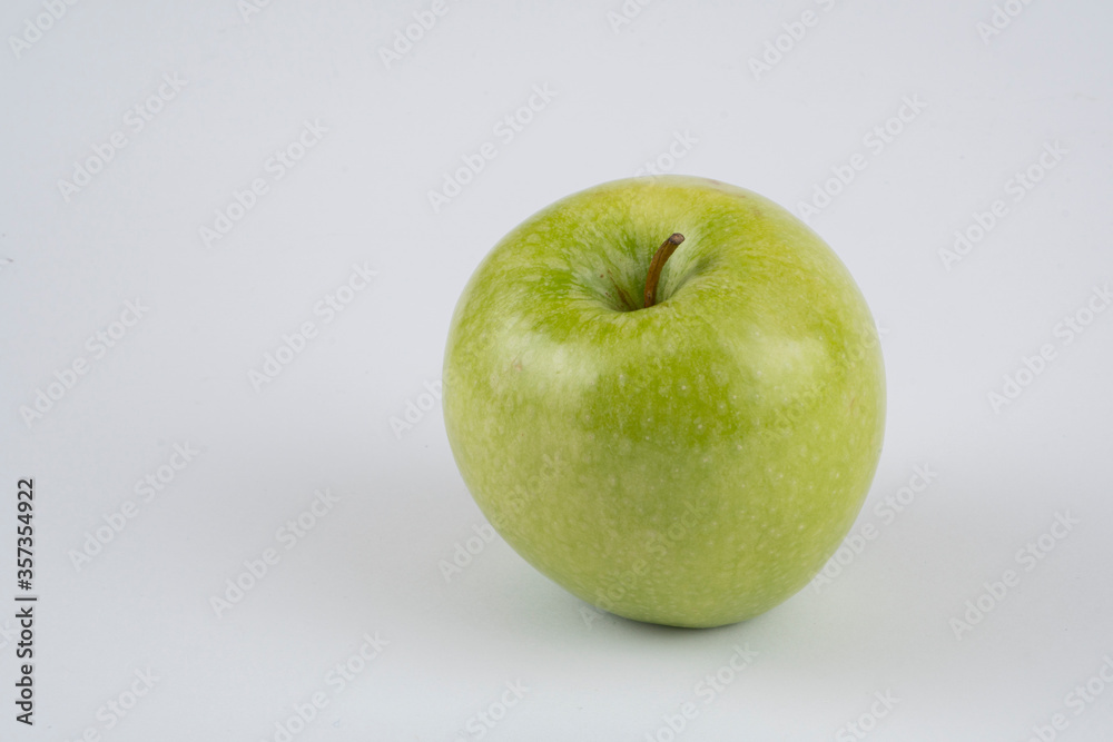 Red and green apple, half apple, bitten apple on a white background, seeds Red and green apple, half apple, bitten apple on a white background, seeds