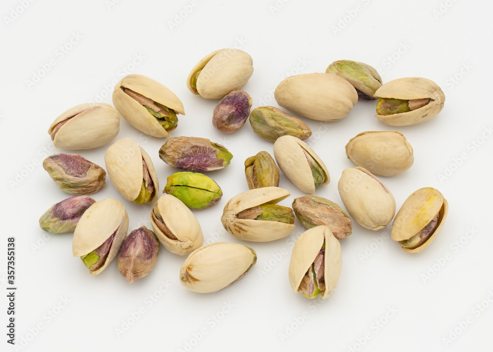 Pistachio nuts on white background. Top view.