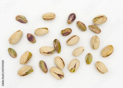 Pistachio nuts on white background. Top view. Top view.