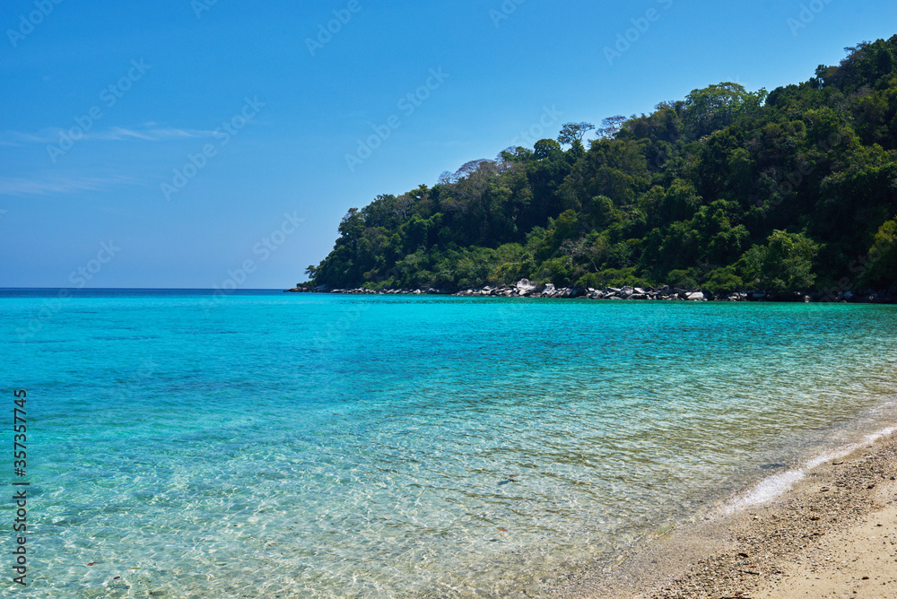 Fototapeta premium Tropical scenery view. Beach of Tioman island in Malaysia with perfect white sand, palm trees, turquoise water and deep blue sky. Idyllic landscape. Summer vacation and tropical beach concept.