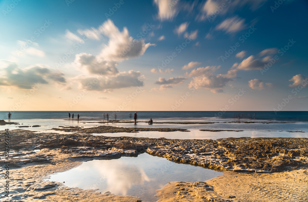 Clouds movement and reflections on sea beach Clouds movement and reflections on sea beach