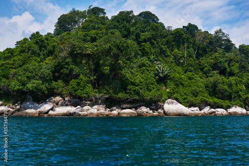 Turquoise sea, rain forest, rocks, ocean. Exploring tropical paradise island. Perfect getaway. Relaxing. Travel concept and idea. Beautiful azure ocean.