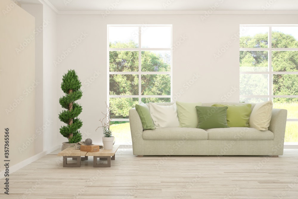 Fototapeta premium White living room with sofa and summer landscape in window. Scandinavian interior design. 3D illustration