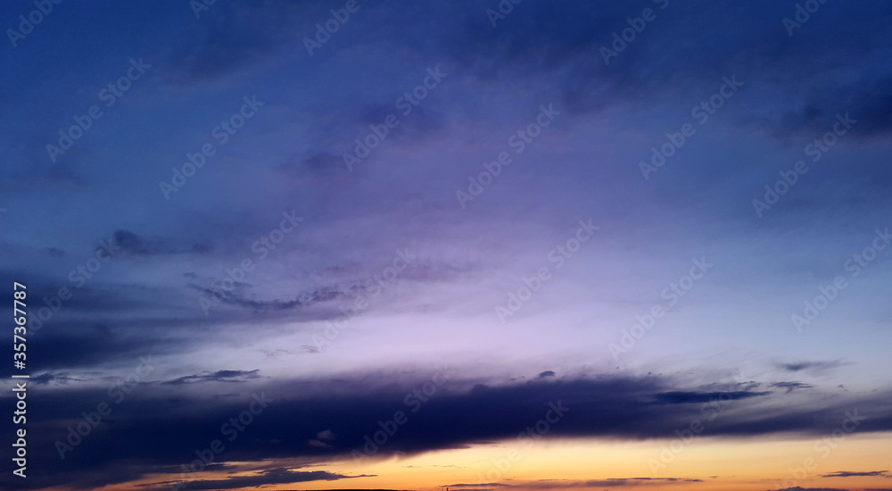 Fototapeta premium dark blue sky with bright orange sunset