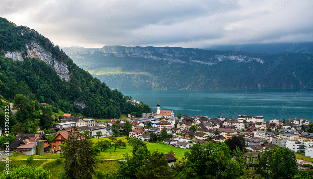 Fototapeta premium View of Lake Lucerne with Gersau town and Swiss Alps in the background. Canton of Schwyz, Switzerland.