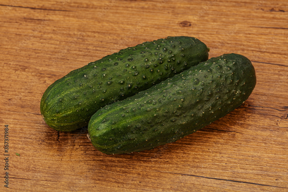 Green fresh cucumbers over background Green fresh cucumbers over background