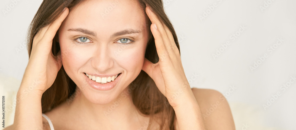 Naklejka premium Young beauty facial portrait. Anti acne cosmetology treatment. Smile with teeth. Female adult girl at salon medicine procedure.