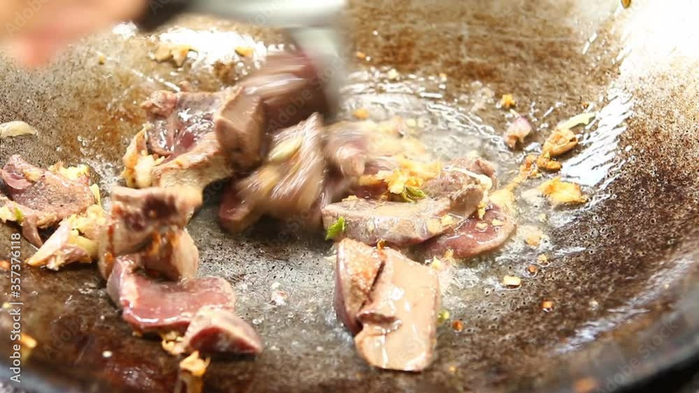 Frying pork liver in pan, Chiangmai Thailand Frying pork liver in pan, Chiangmai Thailand
