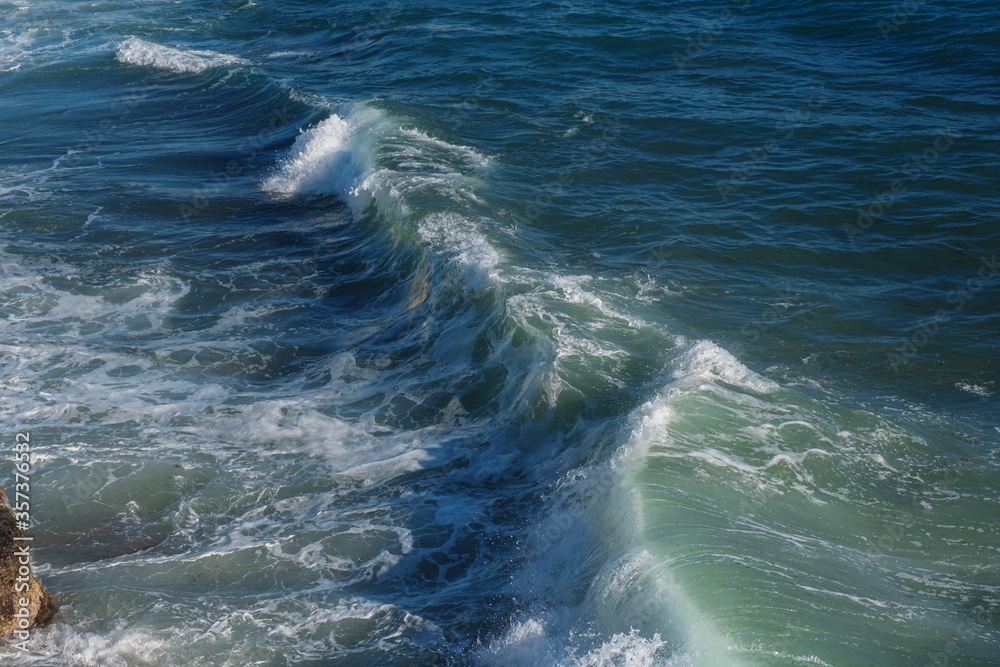 Ocean wave background breaking sea water rocky shore Ocean wave background breaking sea water rocky shore