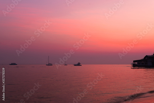 silhouette of fishing boats on lake at sunset © yupachingping
