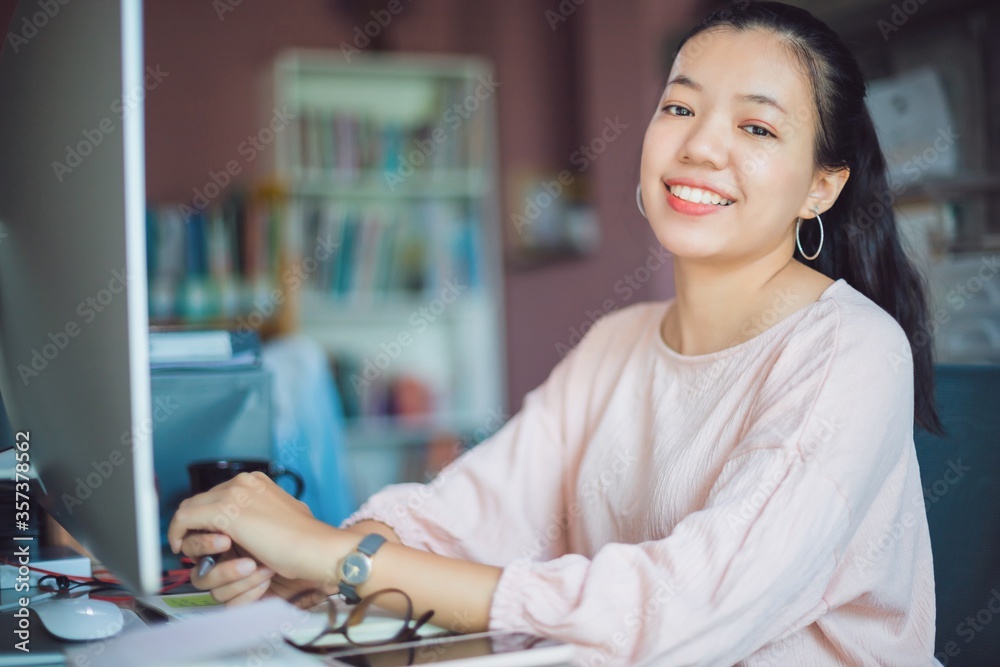 Asian young business woman working from home office.New normal lifestyle concept of lockdown, quarantine and social distancing to stop the spread disease of Coronavirus.Remote work online technology. Asian young business woman working from home office.New normal lifestyle concept of lockdown, quarantine and social distancing to stop the spread disease of Coronavirus.Remote work online technology.