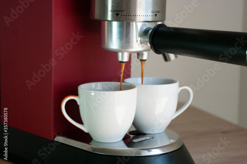 Red coffee machine and two cups, mockup, espresso make.