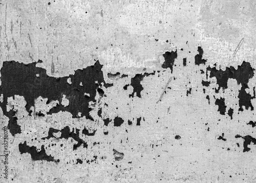 Monochrome of abrasive black on gray concrete wall texture.