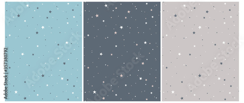 Tiny Stars Vector Patterns. Irregular Hand Drawn Simple Starry Sky Print for Fabric, Textile, Wrapping Paper. Infantile Style Galaxy Design. ittle Stars Isolated on a Gray, Blue and Turquoise.