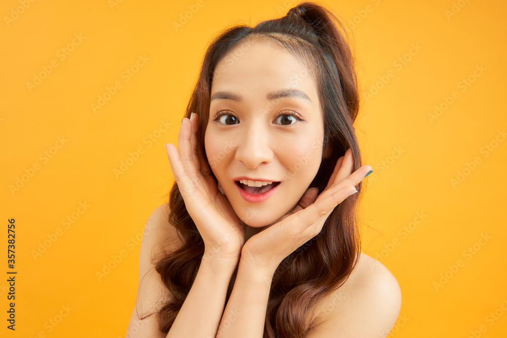 Adorable girl porrtrait isolated over orange background. Adorable girl porrtrait isolated over orange background.