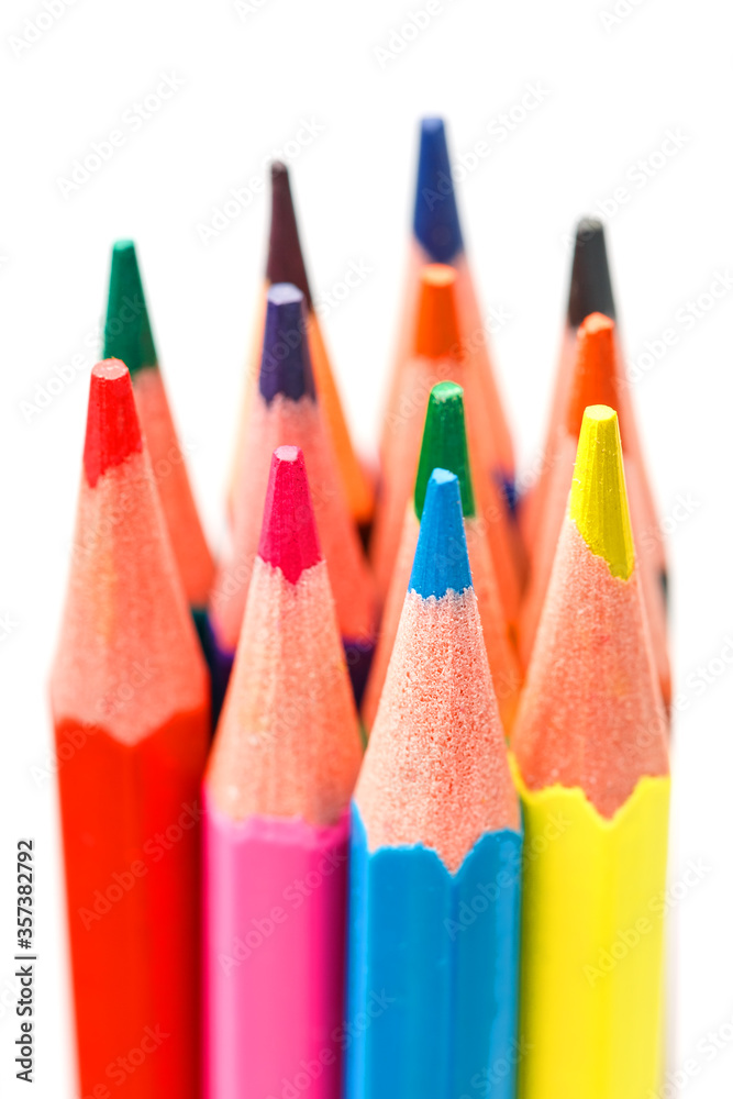 Colored pencils close up on white background, free space for text. Colored pencils close up on white background, free space for text.