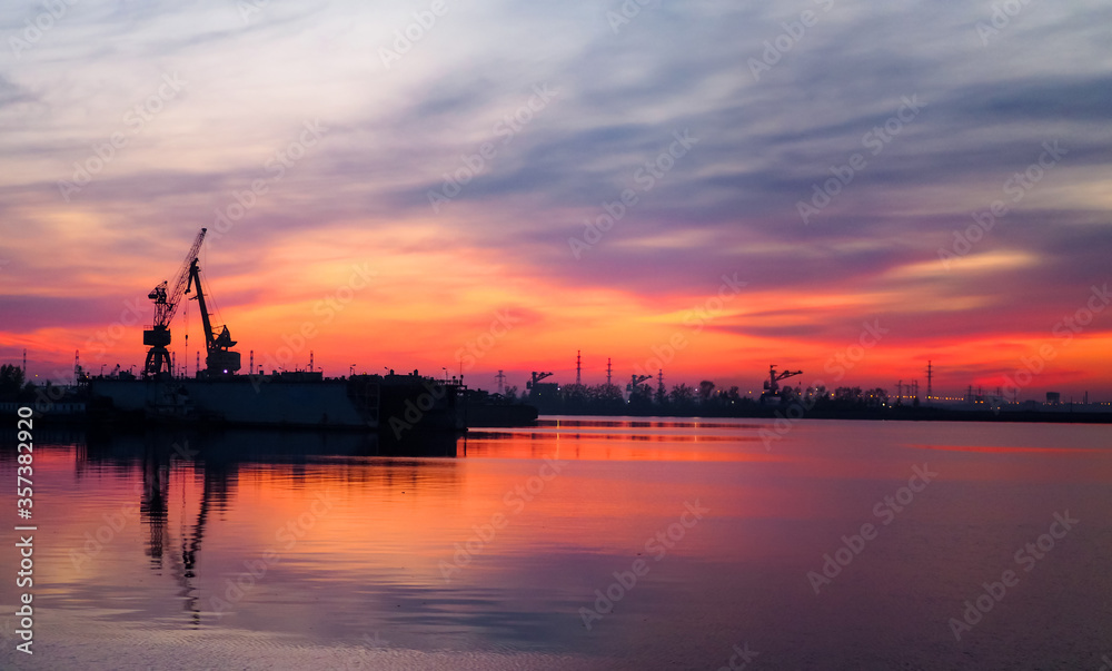 Industrial port and docks at sunset