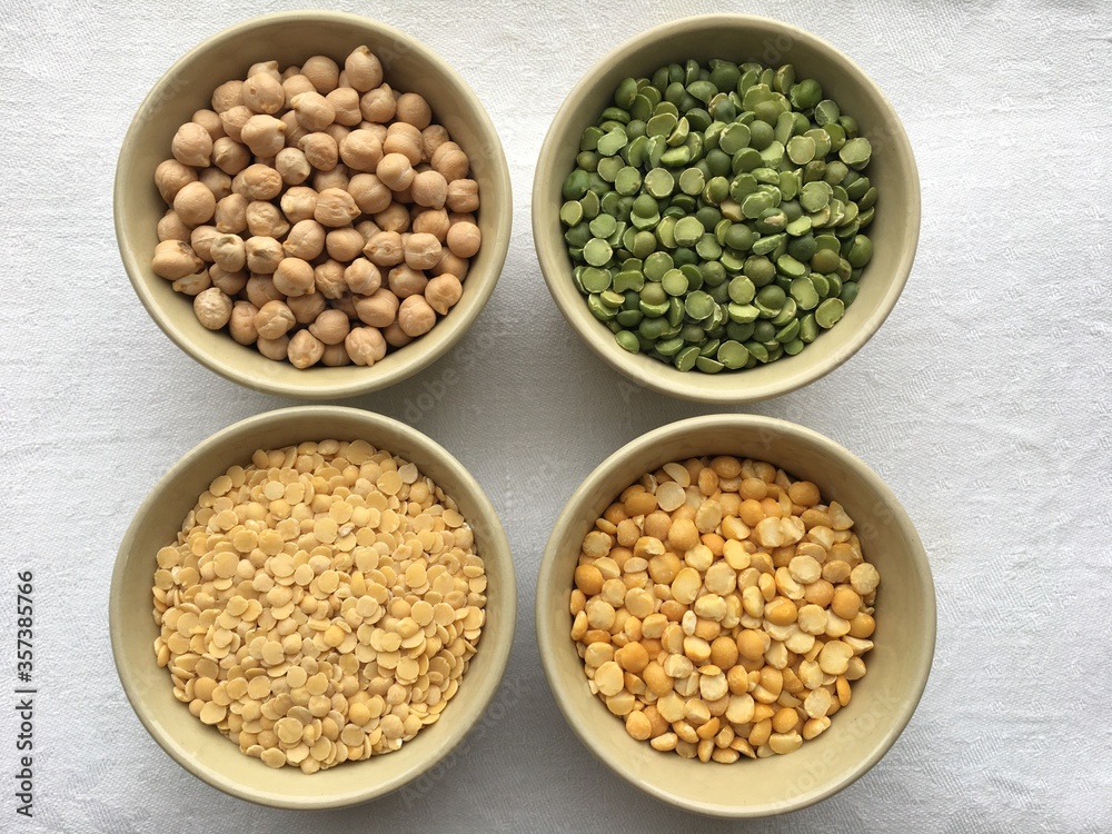 Round bowls with different legumes, peas, chickpeas and lentils on a white background. High quality photo Round bowls with different legumes, peas, chickpeas and lentils on a white background. High quality photo
