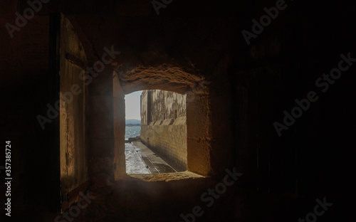 old window in a stone wall © Alex Castellon